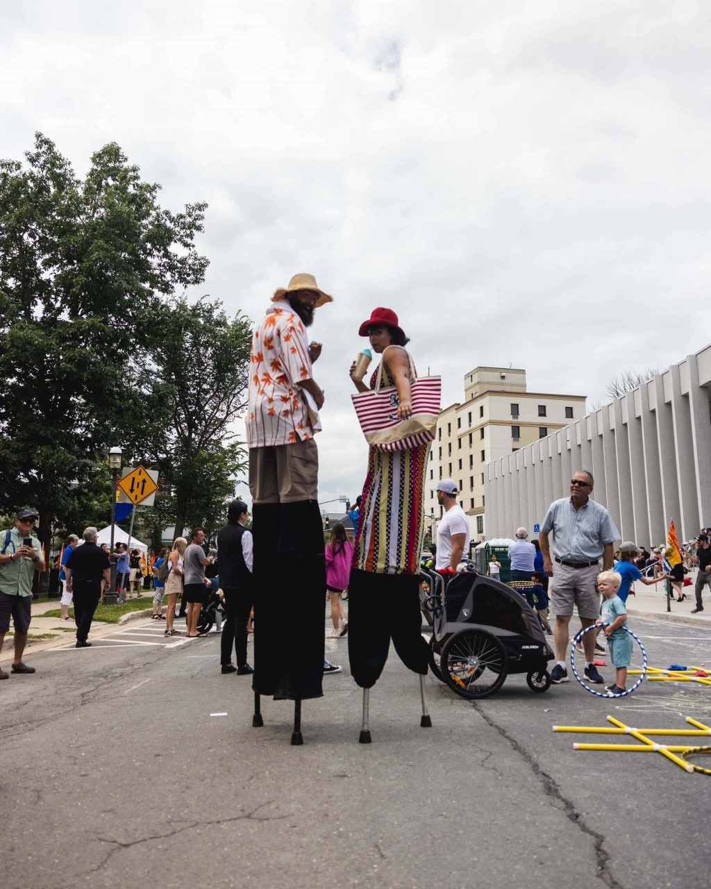 Photo of two people on stilts at a past NB Day event